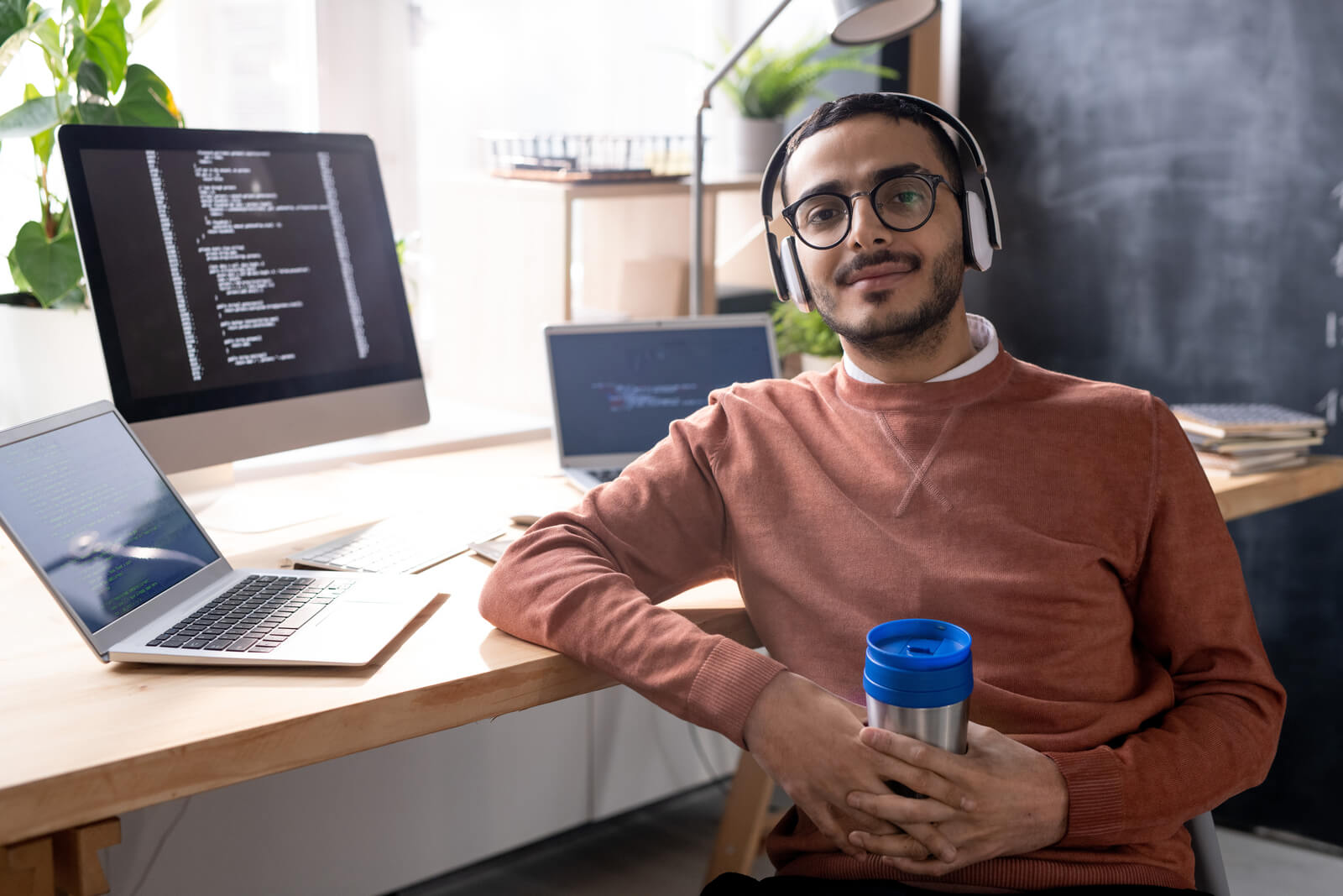 handsome programmer in headphones listening to mus 2023 11 27 04 56 48 utc.jpg